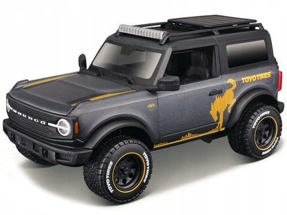 2021 Ford Bronco Badlands Dark Gray Metallic with Gold Graphics and Roof Rack "Off-Road" "Maisto Design" Series 1/24 Diecast Model Car by Maisto