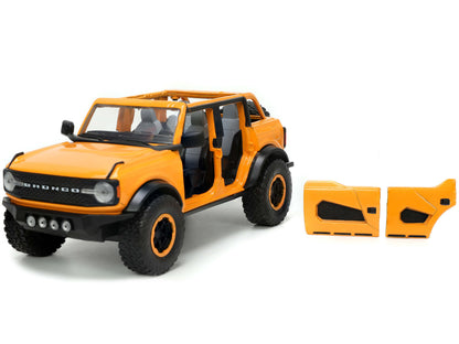 2021 Ford Bronco Orange Metallic with Extra Wheels "Just Trucks" Series 1/24 Diecast Model Car by Jada