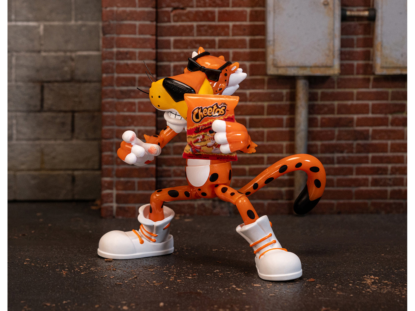 Chester Cheetah 5.5" Glow-in-the-Dark Figure with Accessories and Alternate Head and Hands "Flamin' Hot Cheetos Crunchy" Model by Jada