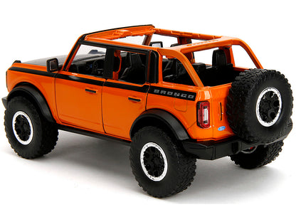 2021 Ford Bronco Open-Top Orange with Black Stripes and Hood with Extra Wheels "Just Trucks" Series 1/24 Diecast Model Car by Jada