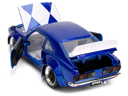 1974 Mazda RX-3 Candy Blue with White Interior and Graphics and Blue Ranger Diecast Figure "Power Rangers" "Hollywood Rides" Series 1/24 Diecast Model Car by Jada