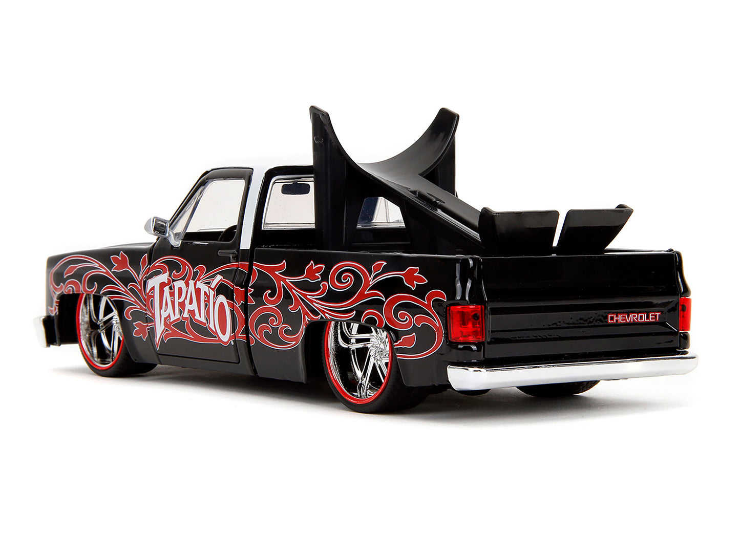 1985 Chevrolet C-10 Pickup Truck Black with White Top and Graphics with Charro Man Diecast Figure "Tapatio" 1/24 Diecast Model Car by Jada