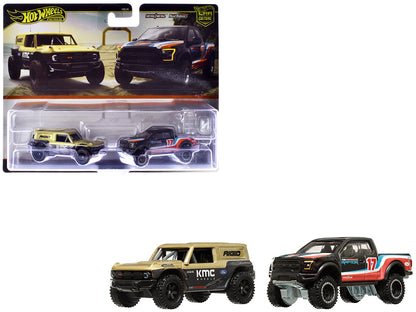 Ford Bronco R Gold Metallic and Black and 2017 Ford F-150 Raptor Pickup Truck #17 Black with Stripes "Car Culture" Set of 2 Cars Diecast Model Cars by Hot Wheels