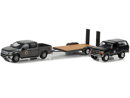 2018 Ford F-150 Pickup Truck Gray with 1992 Ford Bronco "Montana Livestock Association" Black and Flatbed Car Trailer "Yellowstone" (2018-Current) TV Series "Hollywood Hitch & Tow" Series 11 1/64 Diecast Model Cars by Greenlight