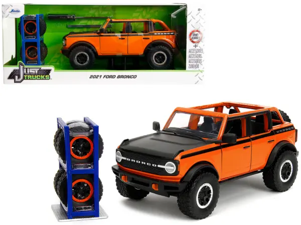 2021 Ford Bronco Open-Top Orange with Black Stripes and Hood with Extra Wheels "Just Trucks" Series 1/24 Diecast Model Car by Jada #1