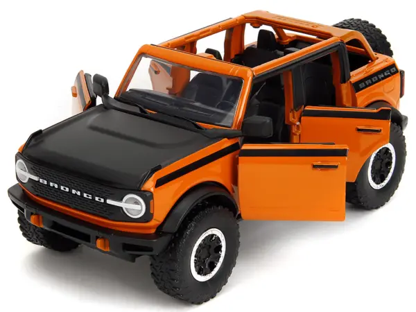 2021 Ford Bronco Open-Top Orange with Black Stripes and Hood with Extra Wheels "Just Trucks" Series 1/24 Diecast Model Car by Jada #2