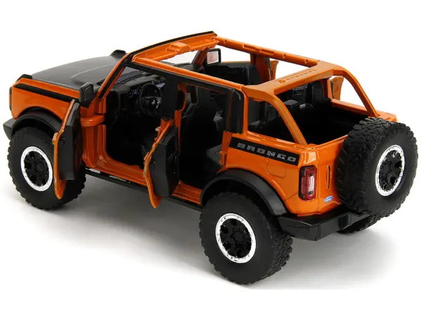 2021 Ford Bronco Open-Top Orange with Black Stripes and Hood with Extra Wheels "Just Trucks" Series 1/24 Diecast Model Car by Jada #4