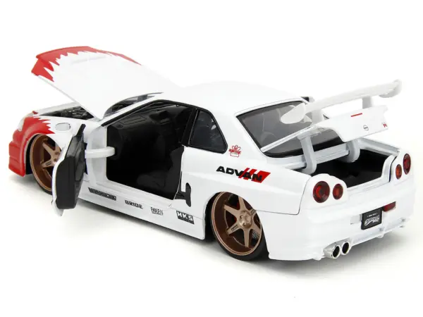 2002 Nissan Skyline GT-R (R34) RHD (Right Hand Drive) White with Red Graphics and Ryu Diecast Figure "Street Fighter" Video Game "Anime Hollywood Rides" Series 1/24 Diecast Model Car by Jada #4