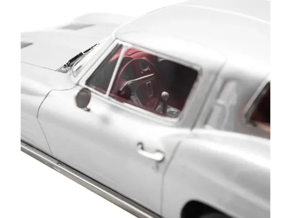1963 Chevrolet Corvette Sting Ray Sebring Silver Metallic with Red Interior 1/18 Diecast Model Car by Norev #2