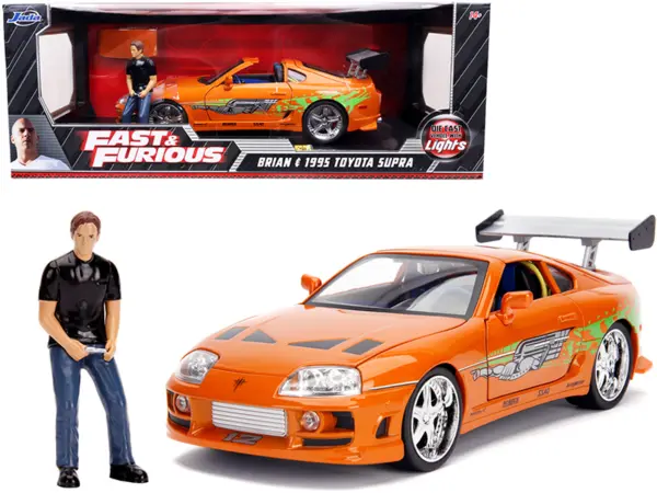 1995 Toyota Supra Orange Metallic with Lights and Brian Figurine "Fast & Furious" Movie 1/18 Diecast Model Car by Jada #1