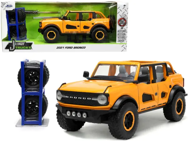 2021 Ford Bronco Orange Metallic with Extra Wheels "Just Trucks" Series 1/24 Diecast Model Car by Jada #1