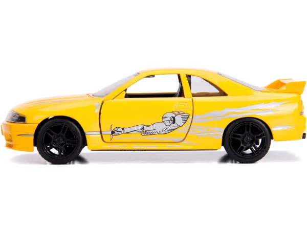 Leon's Nissan Skyline GT-R (BCNR33) Yellow Metallic with Graphics "Fast & Furious" Series 1/32 Diecast Model Car by Jada #2