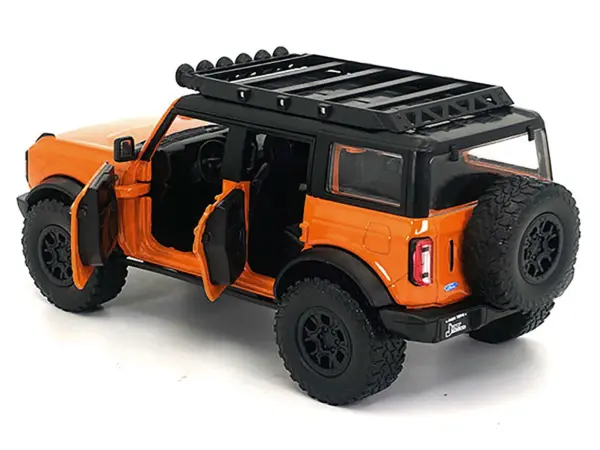 2021 Ford Bronco Orange with Black Stripes and Roof Rack "Just Trucks" Series 1/24 Diecast Model Car by Jada #2