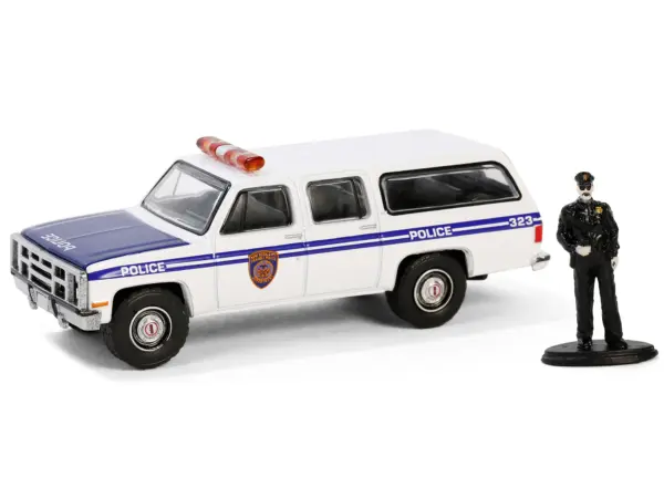 1985 GMC Suburban 2500 "New York City Transit Police Department" White with Blue Stripes and Police Officer Figure "The Hobby Shop" Series 16 1/64 Diecast Model Car by Greenlight #2