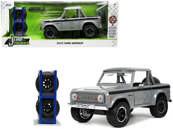 1973 Ford Bronco Pickup Truck Gray with Black Stripes with Extra Wheels "Just Trucks" Series 1/24 Diecast Model Car by Jada #1