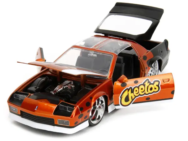 1985 Chevrolet Camaro Z/28 Orange Metallic with Graphics and Chester Cheetah Diecast Figure "Cheetos" "Hollywood Rides" Series 1/24 Diecast Model Car by Jada #2
