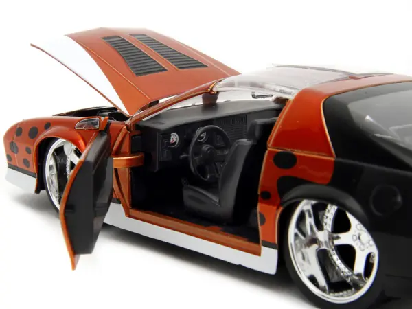 1985 Chevrolet Camaro Z/28 Orange Metallic with Graphics and Chester Cheetah Diecast Figure "Cheetos" "Hollywood Rides" Series 1/24 Diecast Model Car by Jada #3